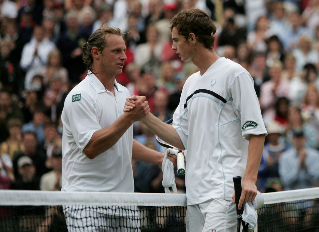 Andy Murray and David Nalbandian shake hands at the net after their match at Wimbledon in 2005
