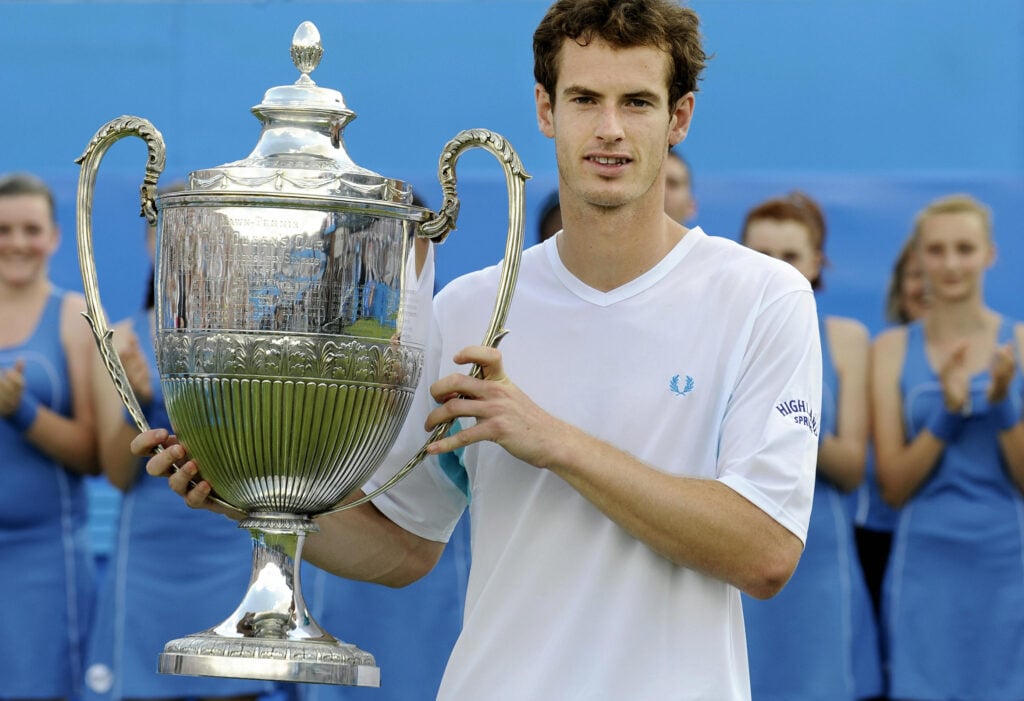 Andy Murray lifts the trophy after beating James Blake of the U.S in the singles final at The AEGON Championships tennis tournament at Queen's Club in west London.