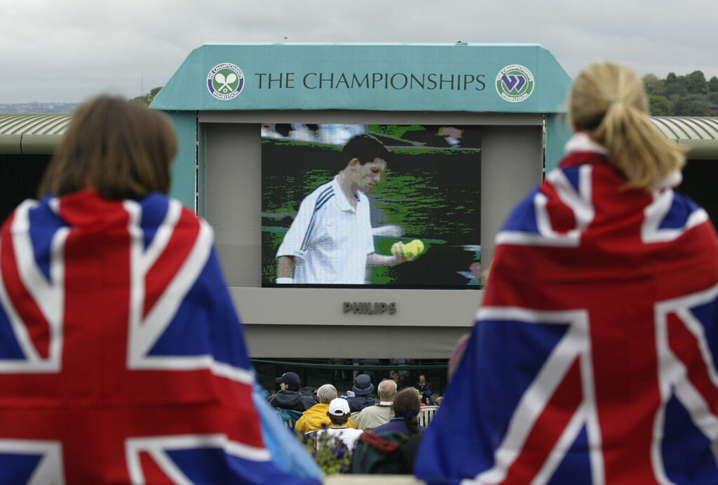 Fans watching Tim Henman play Lleyton Hewitt on Henman Hill in 2002