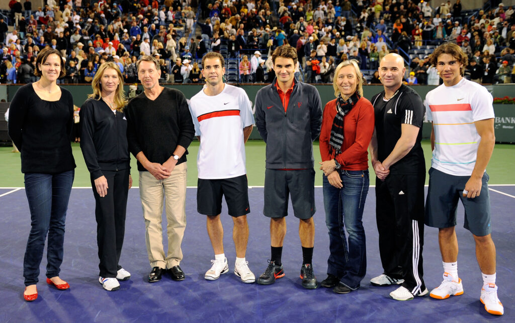 Lindsay Davenport, Steffi Graf of Germany, Oracle CEO Larry Ellison, Pete Sampras, Roger Federer of Switzerland, Martina Navratilova, Andre Agassi, and Rafael Nadal of Spain, pose after Hit for Haiti, a charity event during the BNP Paribas Open.