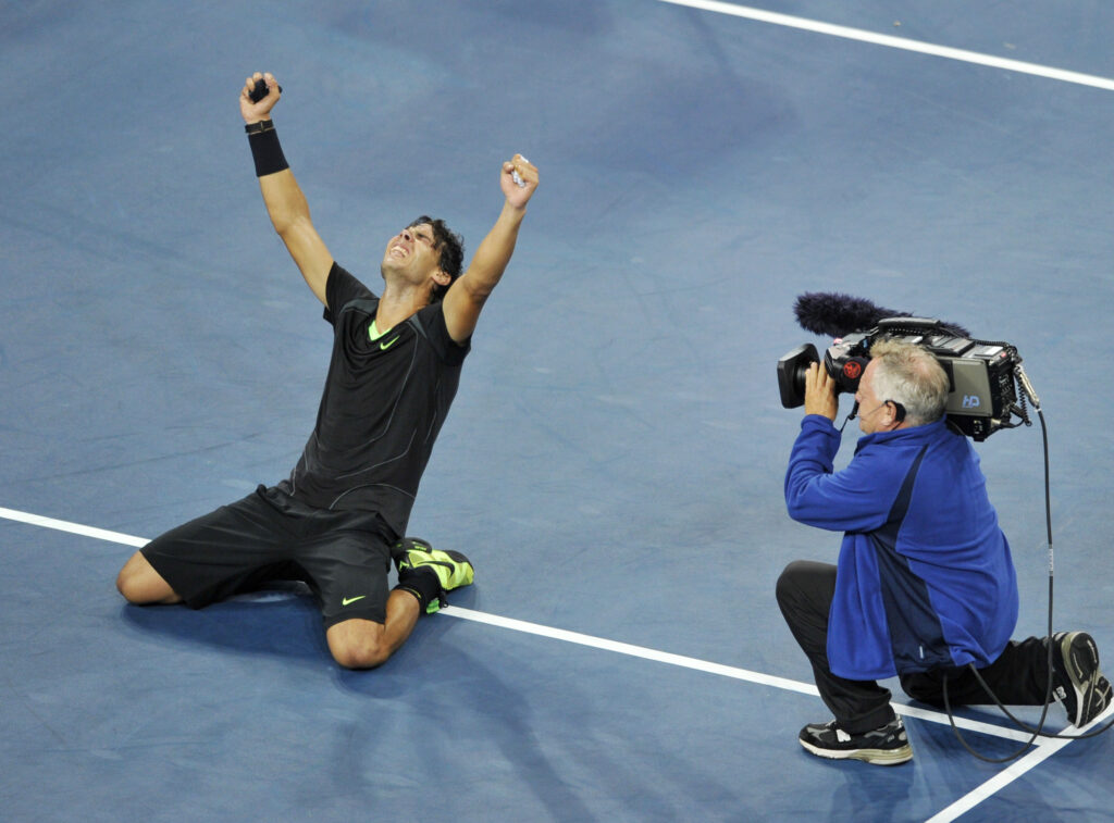 Rafael Nadal of Spain falls to the court