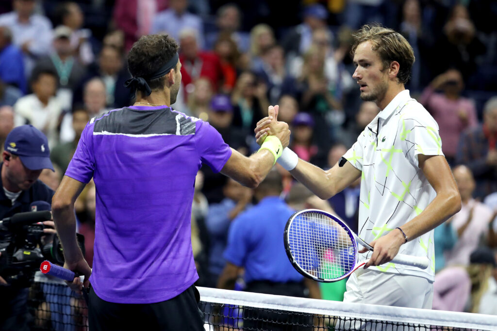 Grigor Dimitrov and Daniil Medvedev shake hands after their 2019 US Open semifinal