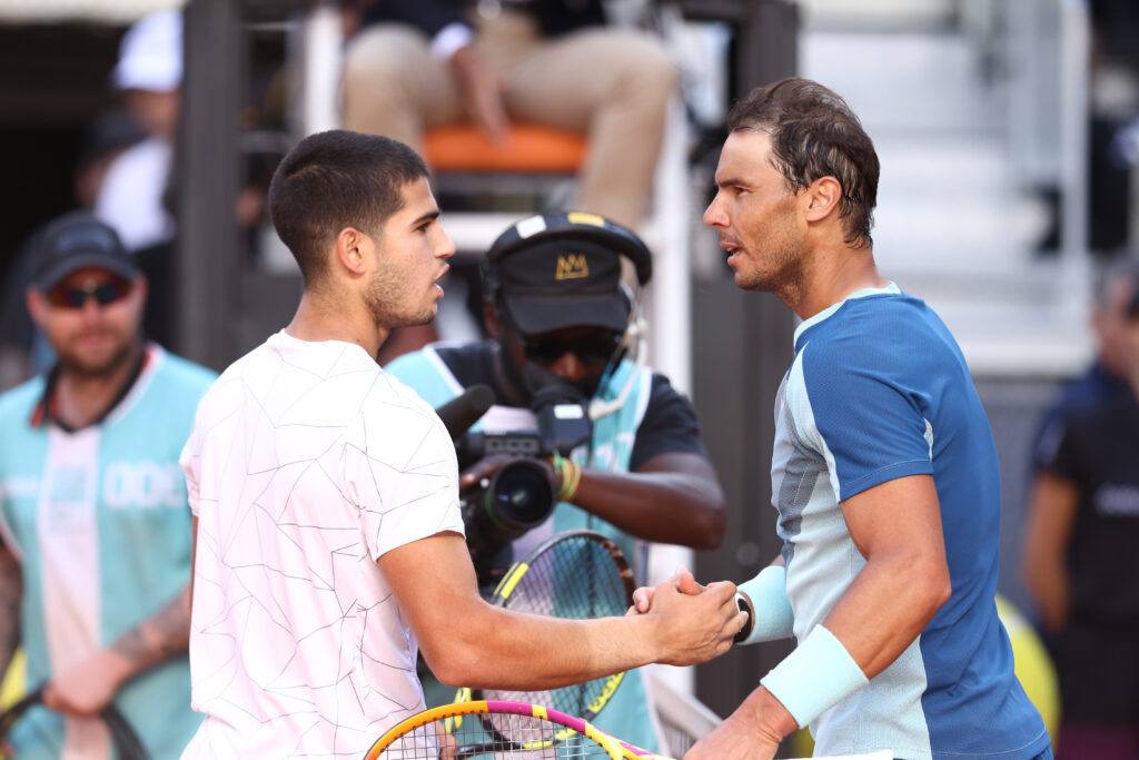 Rafael Nadal and Carlos Alcaraz shake hands after the 2022 Madrid Open