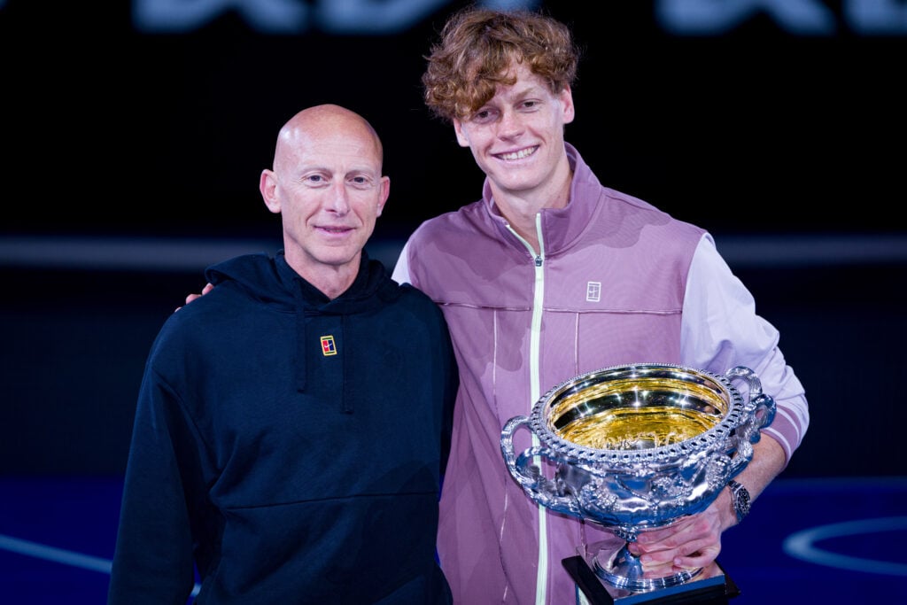 Jannik Sinner and Umberto Ferrara pose together after the 2024 Australian Open final