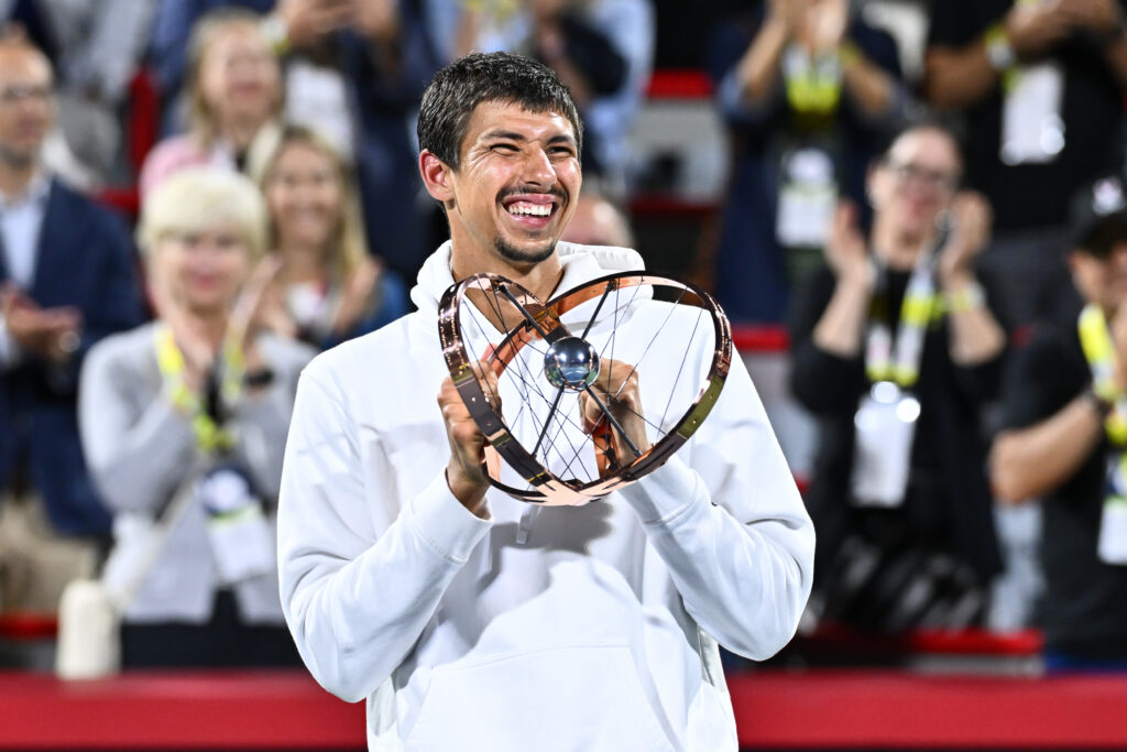 Alexei Popyrin celebrates with the trophy after winning the 2024 Canadian Open