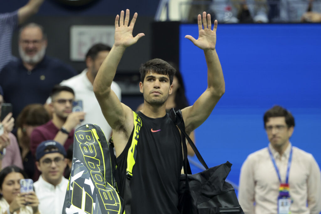 Carlos Alcaraz waves goodbye to the crowd at the 2024 US Open.