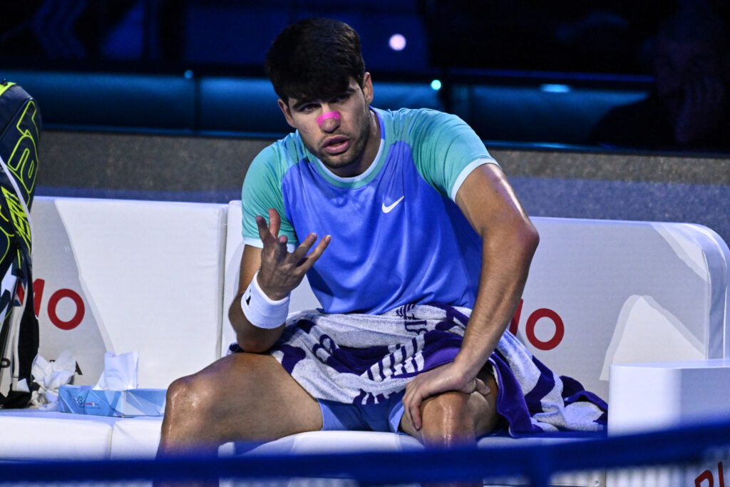 Carlos Alcaraz reacts during his defeat to Alexander Zverev at the 2024 ATP Finals