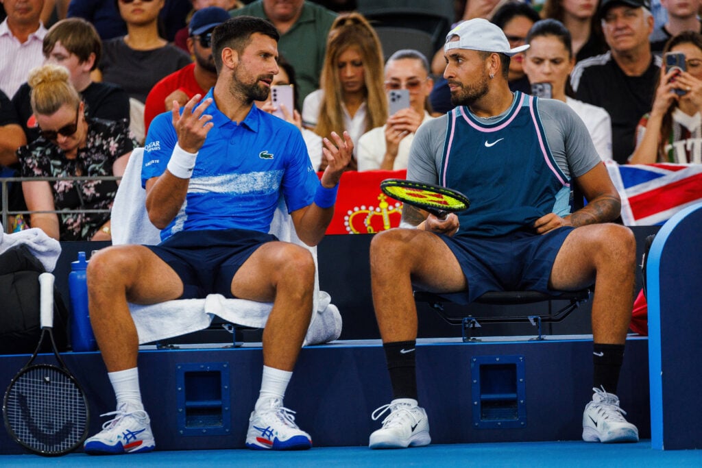 Novak Djokovic of Serbia and Nick Kyrgios chat during their doubles match at the 2025 Brisbane International