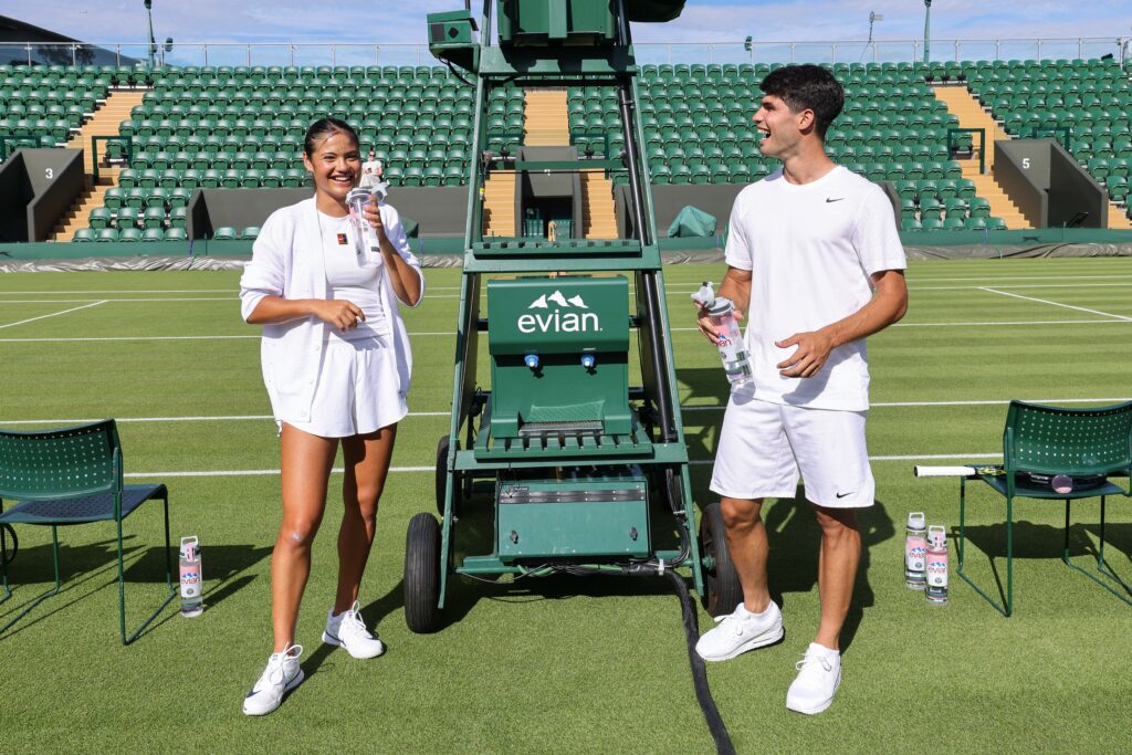Emma Raducanu and Carlos Alcaraz drink Evian water together before the 2025 Wimbledon Championships