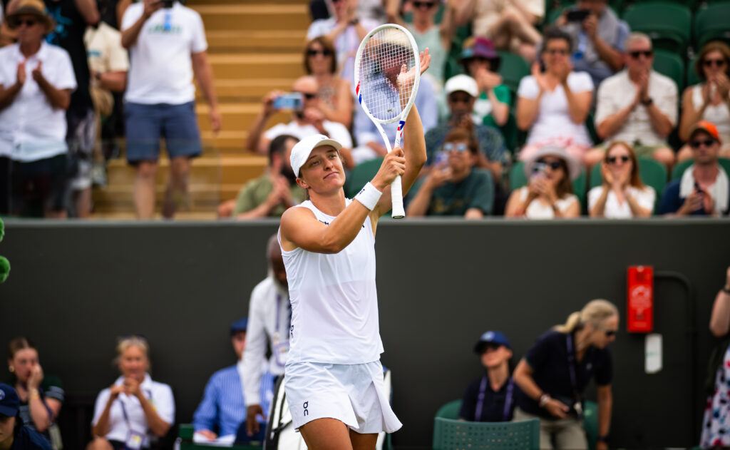 Iga Swiatek celebrates her first-round win at Wimbledon in 2025