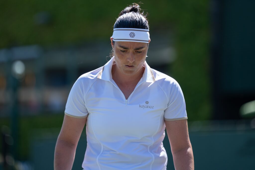 Ons Jabeur looks on during her first-round defeat at Wimbledon in 2025