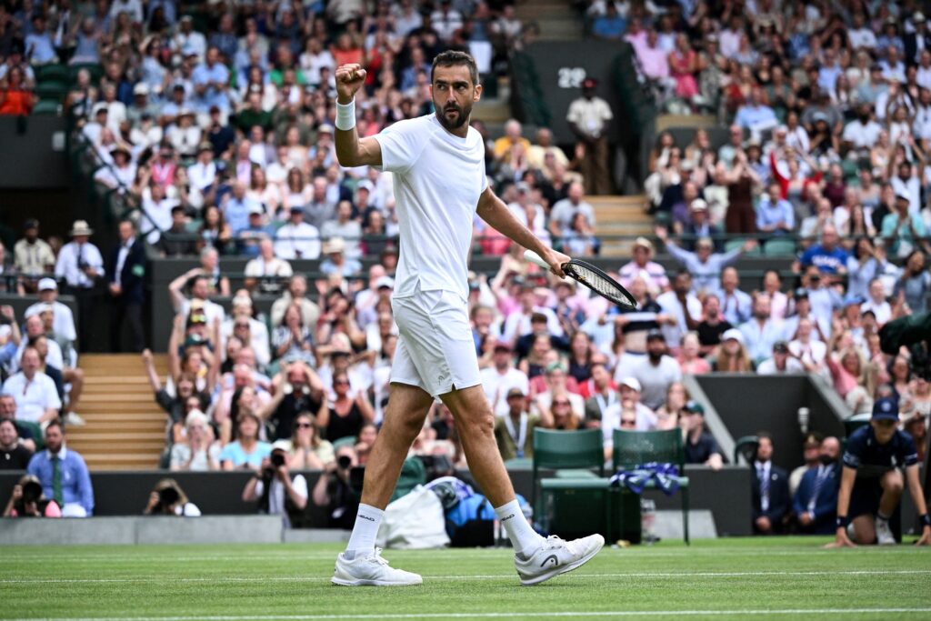 Marin Cilic reacts after defeating Jack Draper at Wimbledon in 2025.