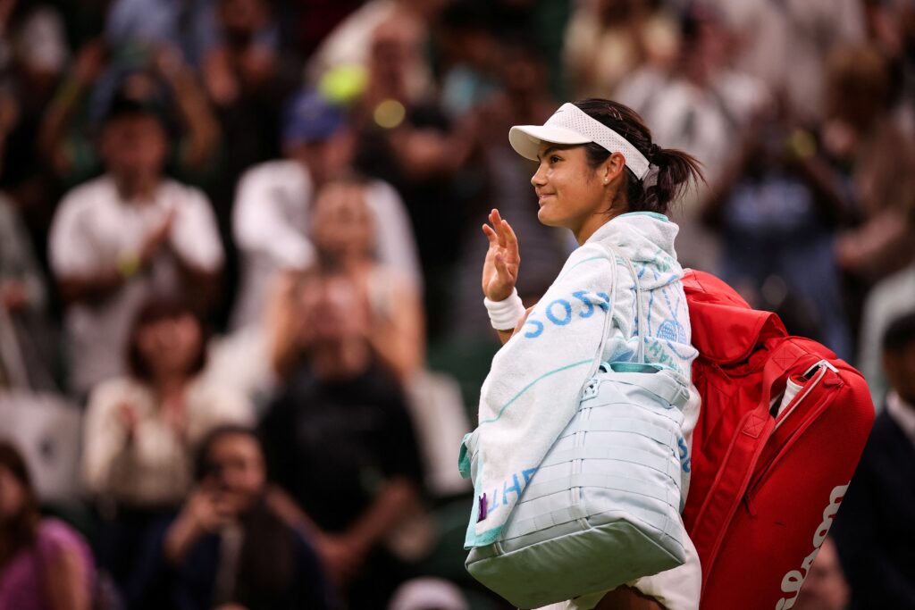Emma Raducanu leaves Centre Court at Wimbledon after losing to Aryna Sabalenka in the third round.