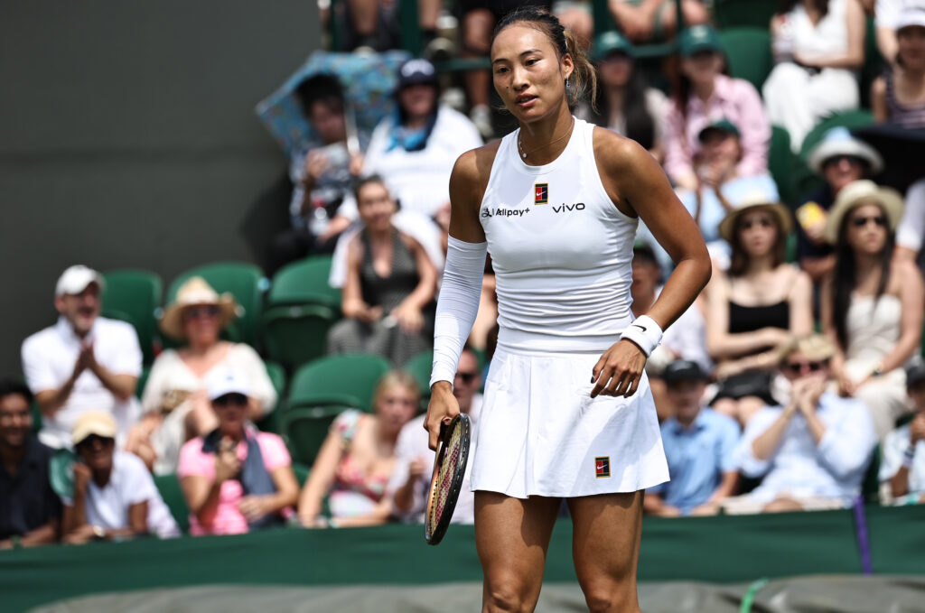 Qinwen Zheng reacts during her first round match at the 2025 Wimbledon Championships