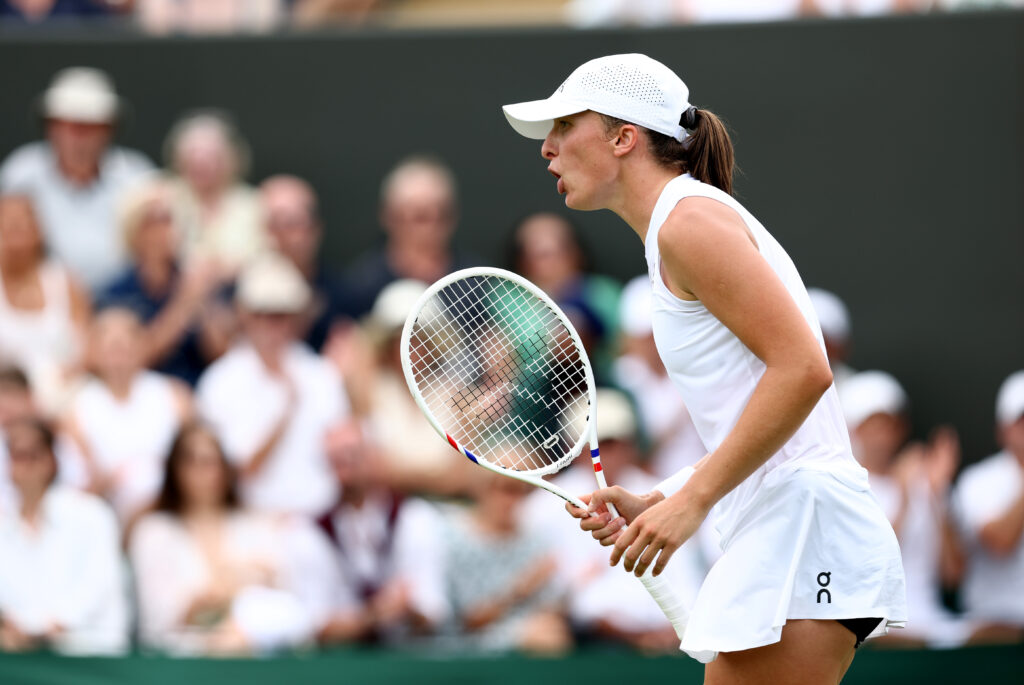 Iga Swiatek reacts on court during Wimbledon 2025