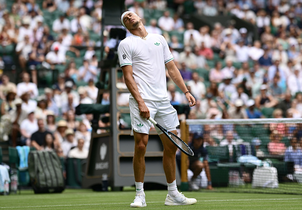 Alexander Zverev looks dejected, rolling his eyes during his first-round defeat at Wimbledon in 2025
