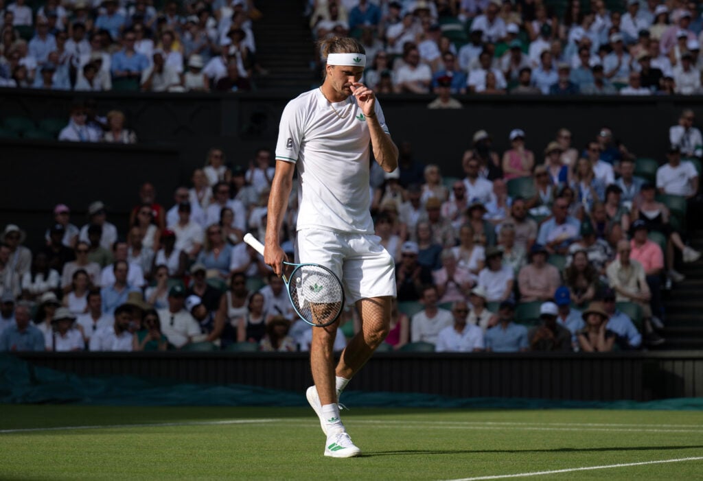 Alexander Zverev looking upset during his first round match at The Championships - Wimbledon 2025