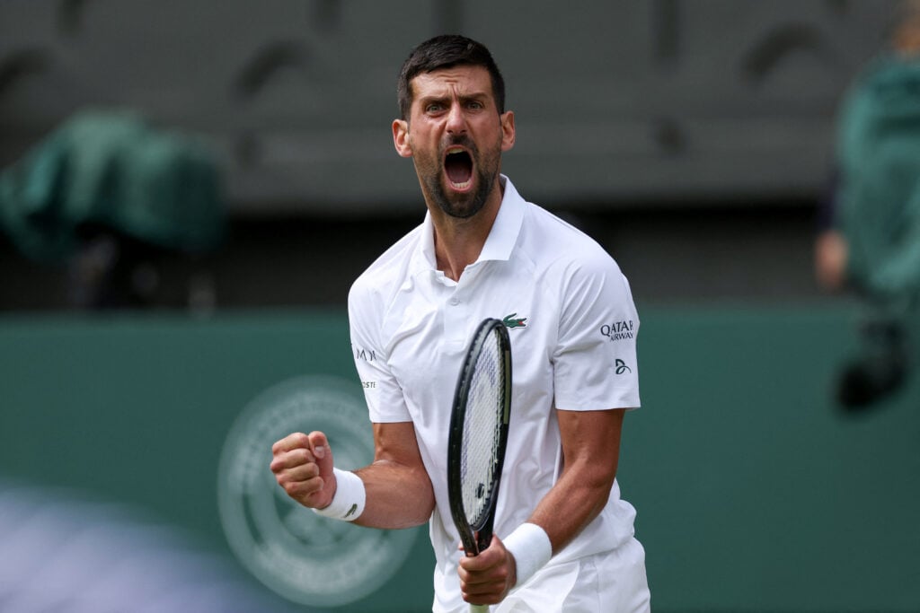 Serbia's Novak Djokovic reacts as he plays against Australia's Alex De Minaur during their men's singles fourth round tennis match on the eighth day of the 2025 Wimbledon Championships at The All England Lawn Tennis and Croquet Club in Wimbledon