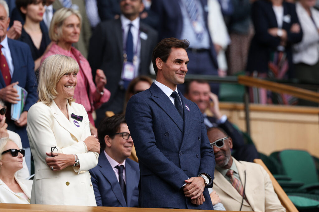 Roger Federer looks on from the royal box