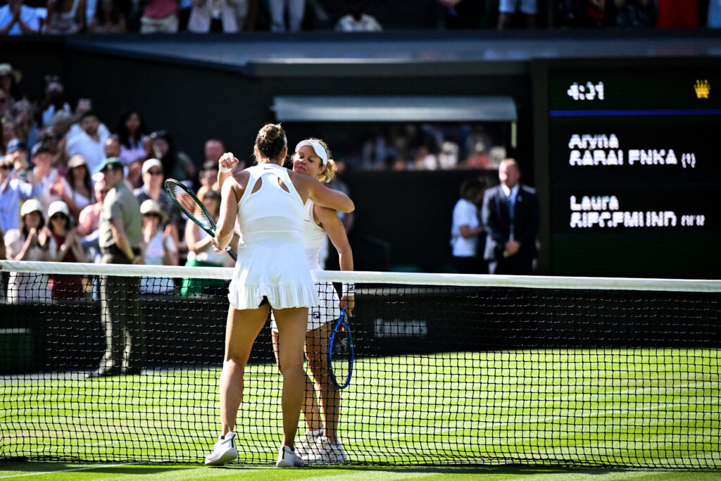 Aryna Sabalenka and Laura Siegemund embrace after their 2025 Wimbledon quarterfinal match