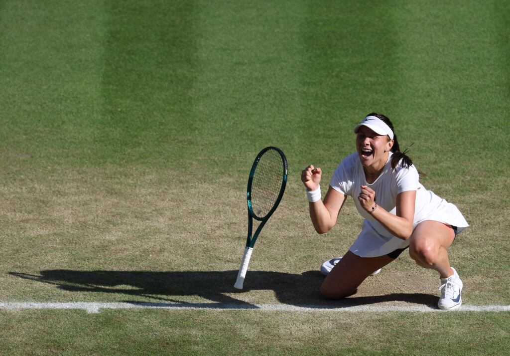 Amanda Anisimova falls to the floor after beating Anastasia Pavlyuchenkova at Wimbledon