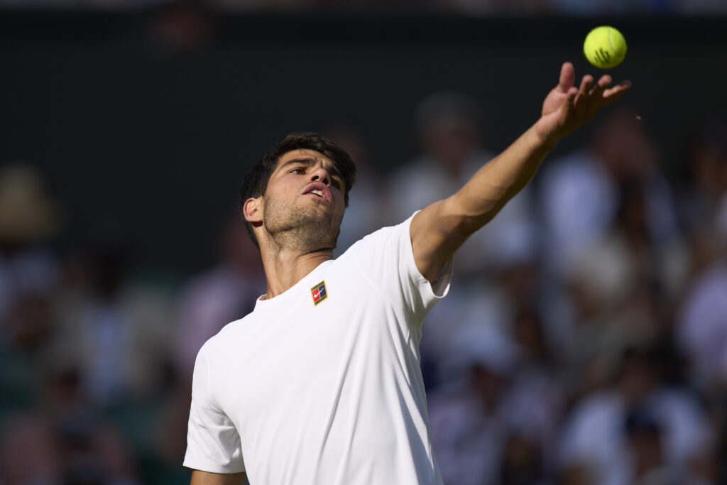 Carlos Alcaraz of Spain serves the ball against Jan-Lennard Struff of Germany on Centre Court during the Gentlemen's third round match on day five of The Championships Wimbledon 2025 at All England Lawn Tennis and Croquet Club.