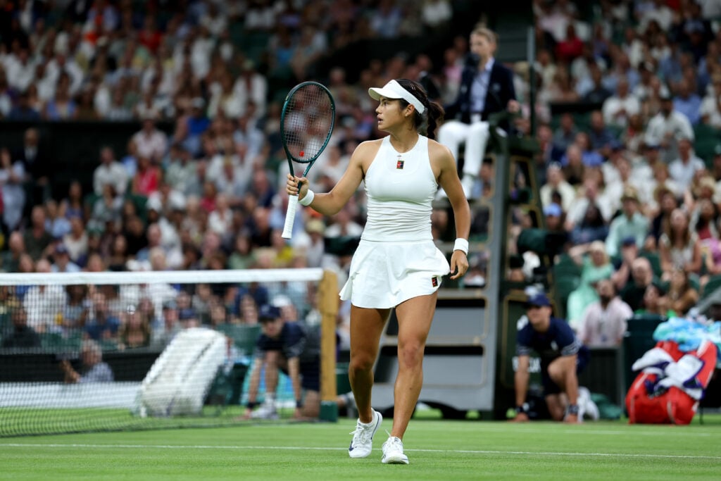 Emma Raducany lifts her racket in celebration
