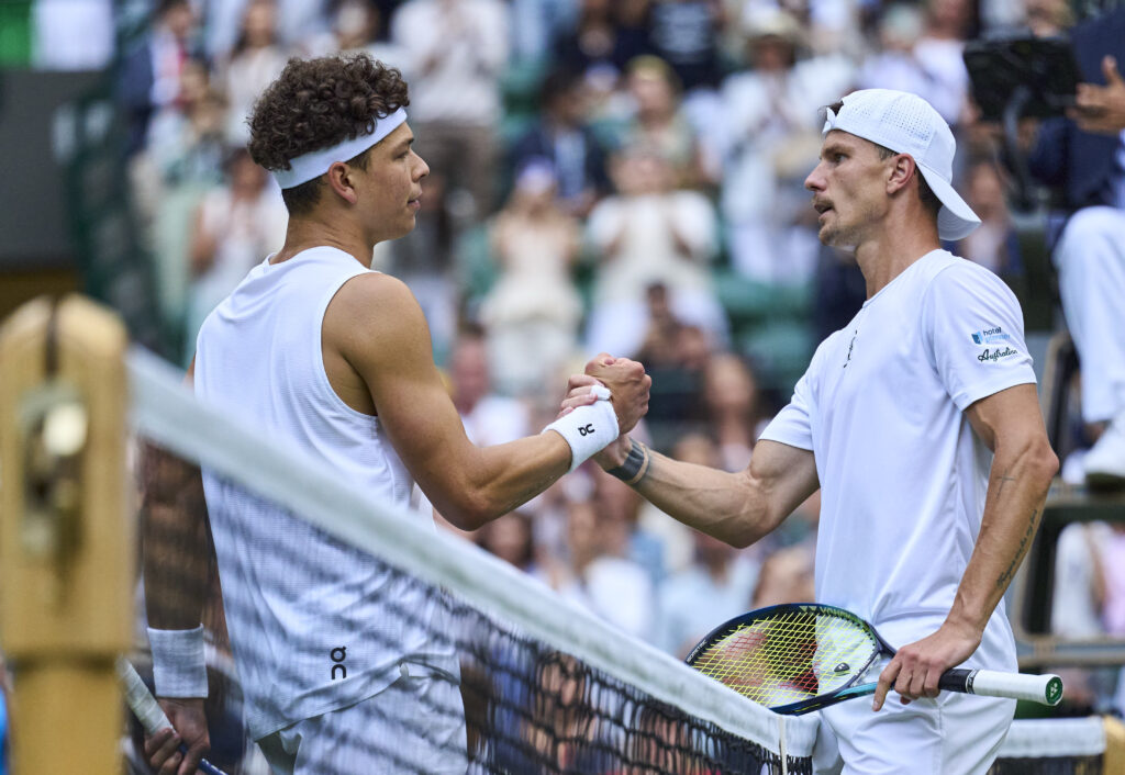 Ben Shelton and Marton Fucsovics shake hands at the net at Wimbledon.