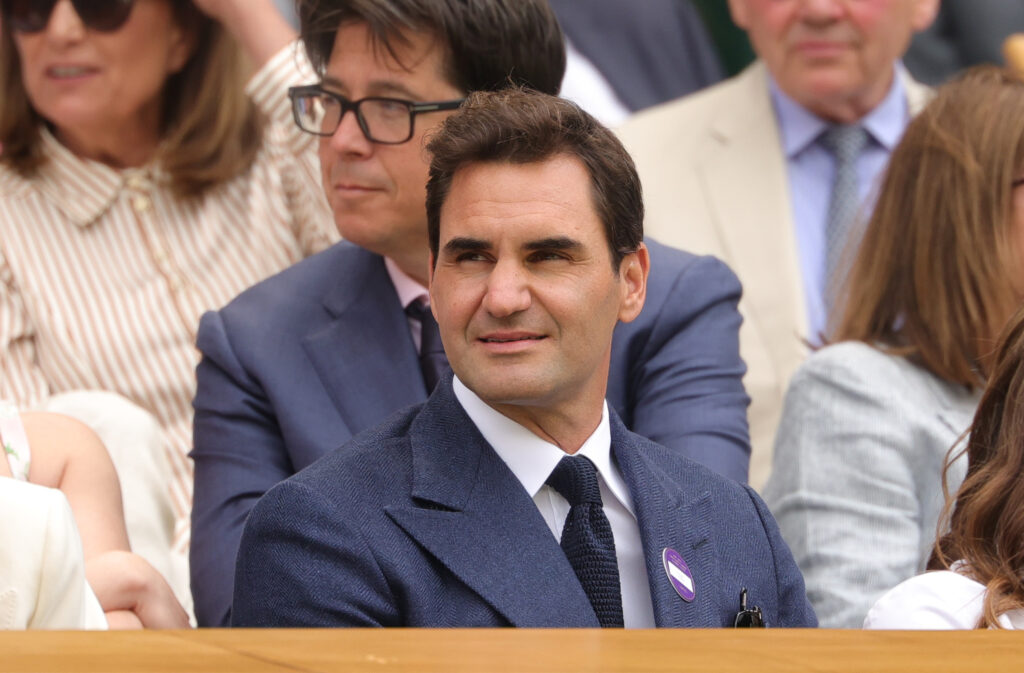 Roger Federer watches Novak Djokovic play Alex de Minaur at Wimbledon in 2025