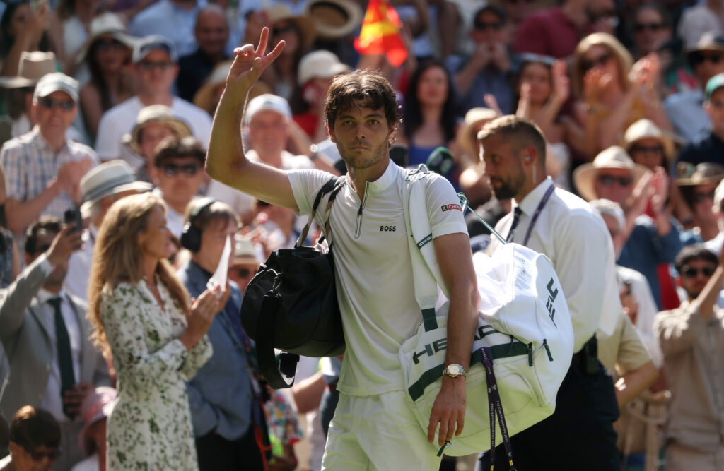 Taylor Fritz acknowledges the Wimbledon crowd after losing the semi-final to Carlos Alcaraz