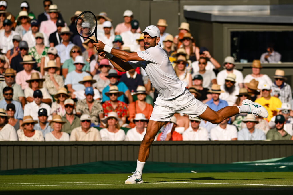 Novak Djokovic hits a backhand