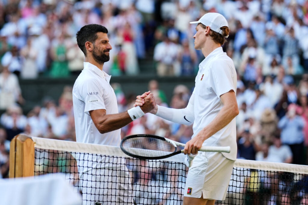 Novak Djokovic and Jannik Sinner shake hands after their 2025 Wimbledon semi-final.