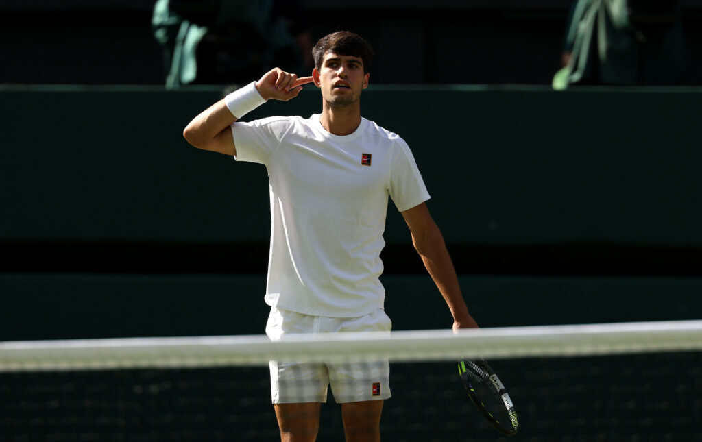 Carlos Alcaraz of Spain celebrates after winning the first set against Jannik Sinner of Italy during the Gentleman's Singles Final on day fourteen of The Championships Wimbledon 2025 at All England Lawn Tennis and Croquet Club.