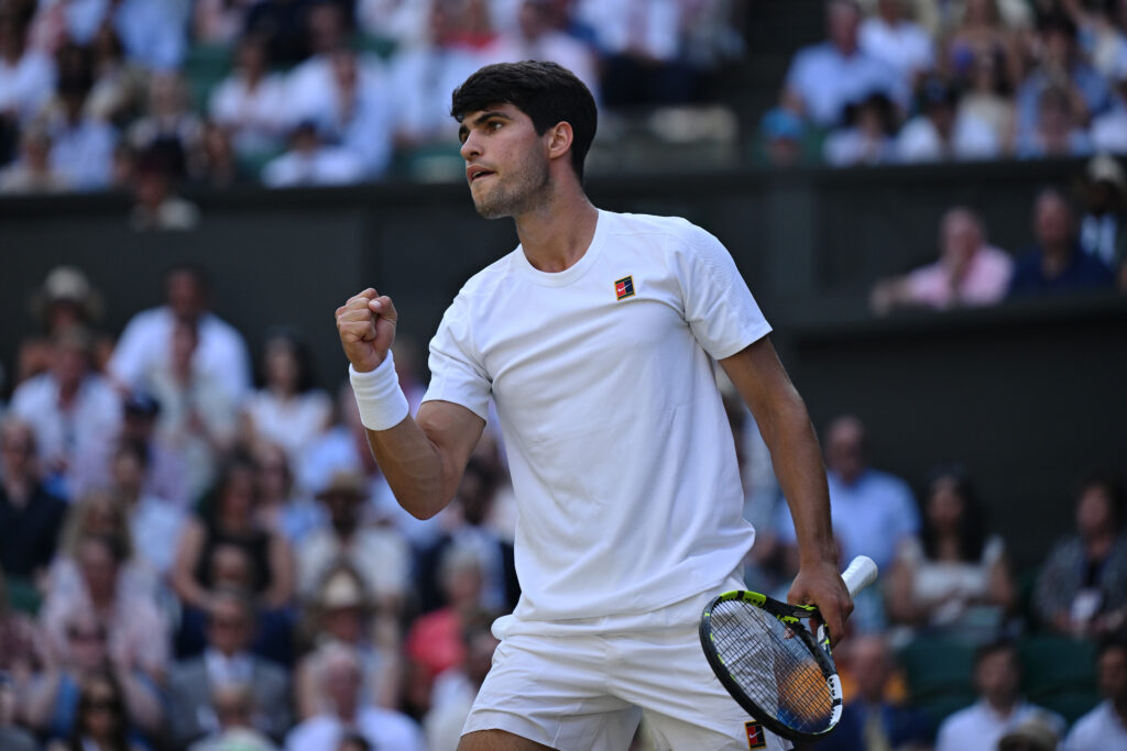 Carlos Alcaraz celebrates a point against Jannik Sinner in the Wimbledon final