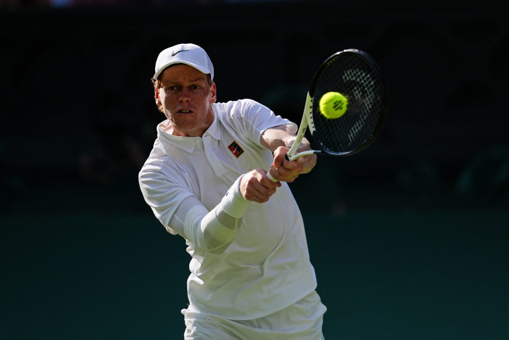 Jannik Sinner hits a backhand at The Championships - Wimbledon 2025