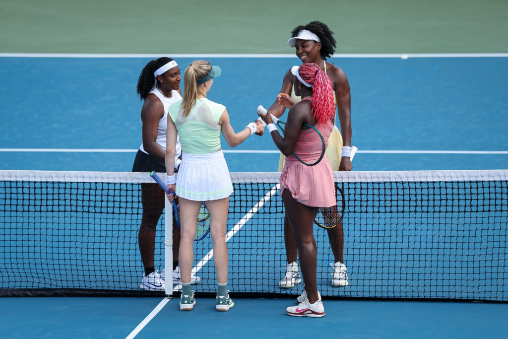 Venus Williams and Hailey Baptiste shake hands with their opponents at the Mubadala Citi DC Open 2025