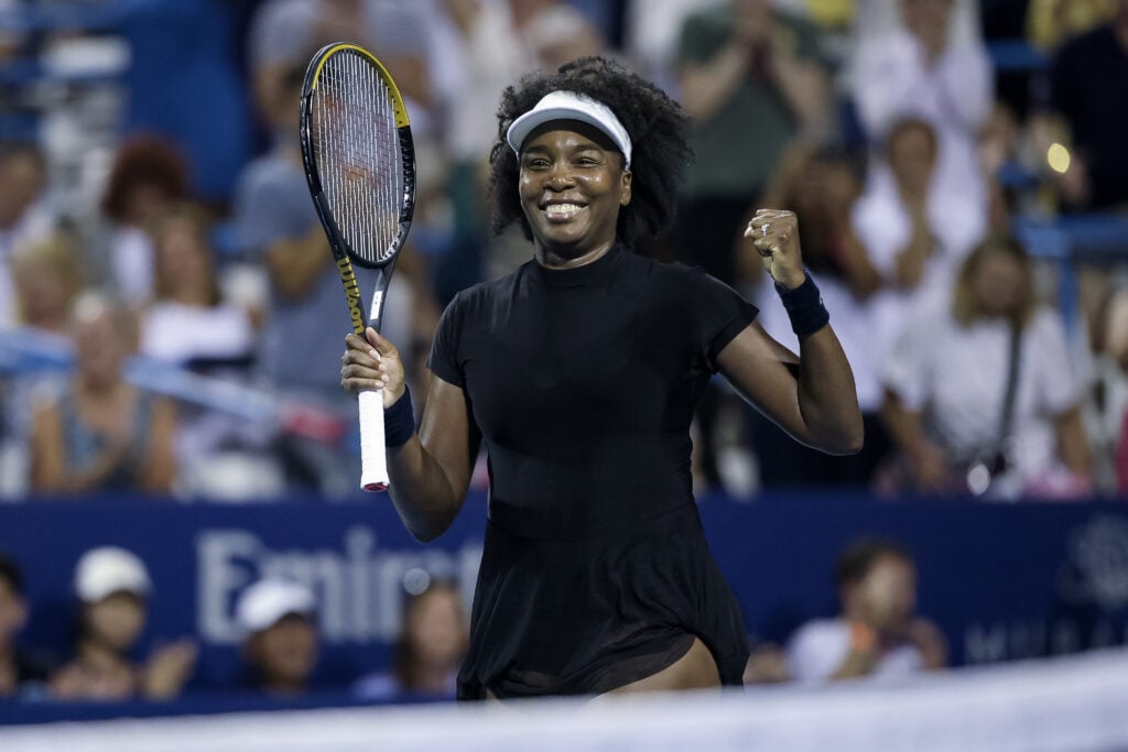 Venus Williams celebrates after winning a women's single match against Peyton Stearns.