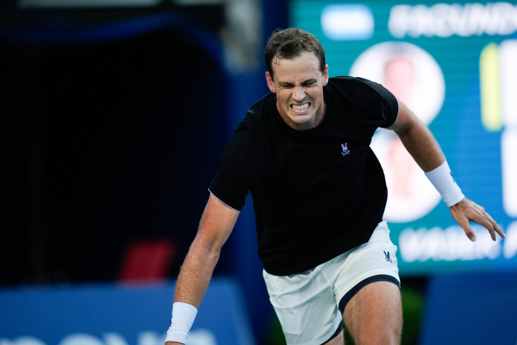 Vasek Pospisil grimaces after getting injured