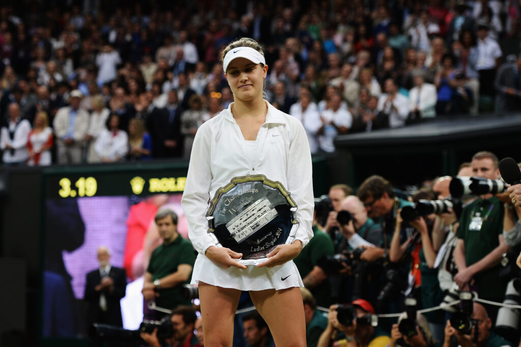 Eugenie Bouchard holding her Wimbledon runner-up trophy in 2014.