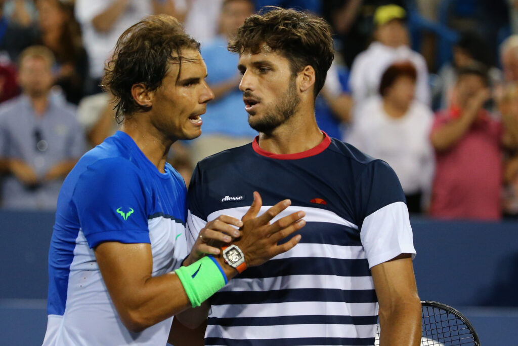 Rafael Nadal of Spain congratulates Feliciano Lopez of Spain following their match on Day 6 of the Western & Southern Open at the Lindner Family Tennis Center.
