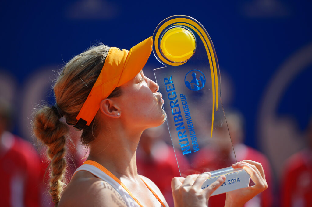 Eugenie Bouchard of Canada kisses the trophy after defeating Karolina Pliskova of Czech Republic during Day 8 of the Nuernberger Versicherungscup.
