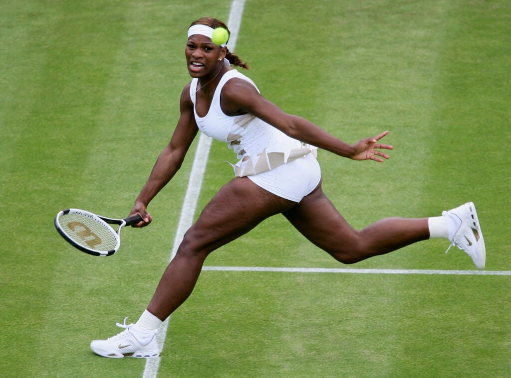 Serena Williams stretches to hit a forehand
