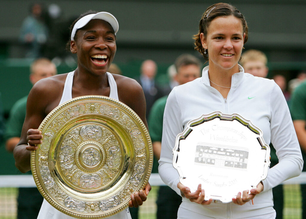 Venus Williams and Lindsay Davenport pose with their trophies after the 2005 Wimbledon final