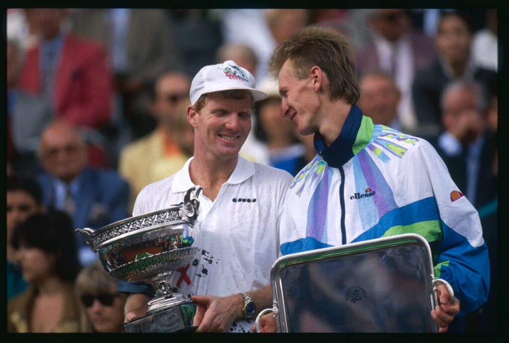 Jim Courier and Petr Korda pose with their trophies after the 1992 French Open final