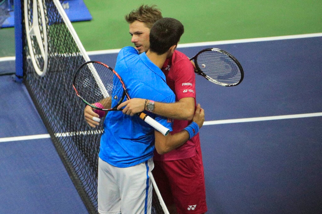 Stan Wawrinka and Novak Djokovic embrace at the net after the 2016 US Open final.