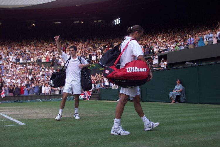 4 Jul 2001:  Tim Henman of Great Britain waves to the crowd after beating Roger Federer of Switzerland during the men's quarter finals of The All E...