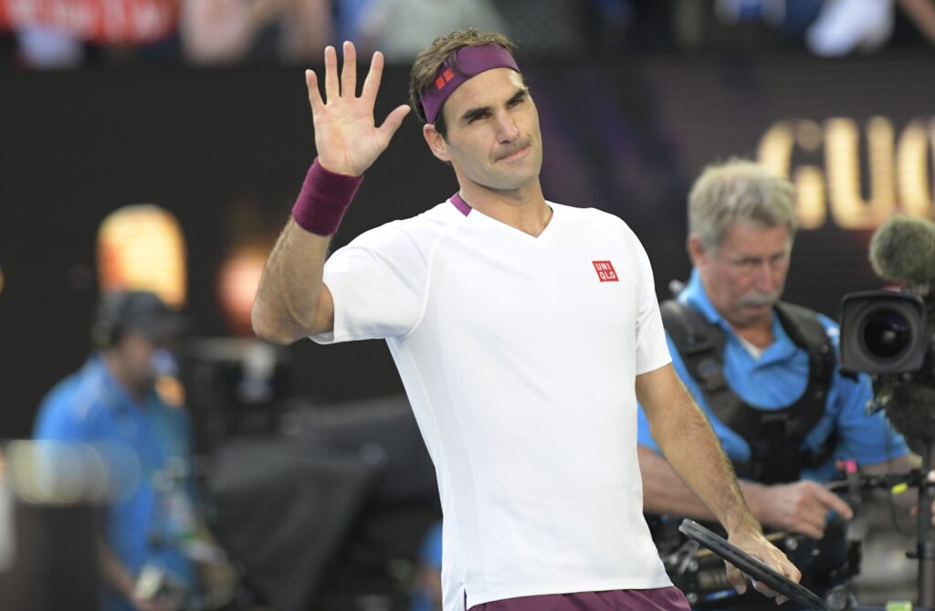 Roger Federer waves to the fans at the Australian Open in 2020.