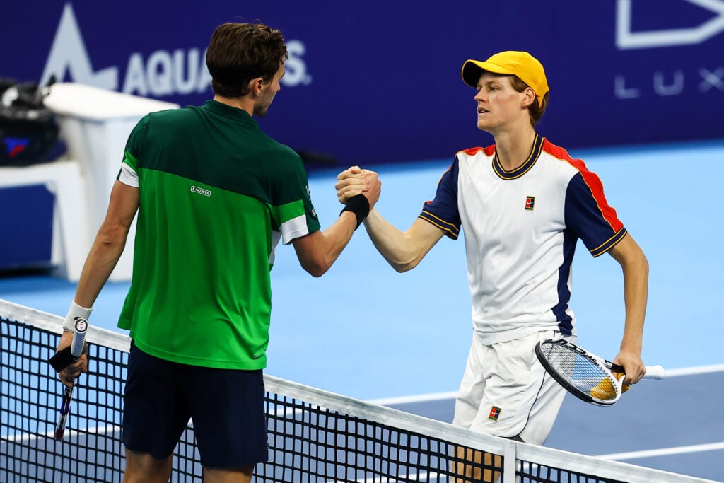 Arthur Rinderknech and Jannik Sinner shake hands after their match at the 2021 European Open