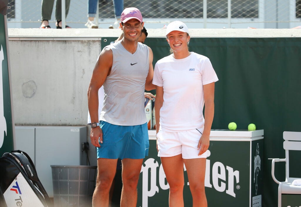 Rafael Nadal and Iga Swiatek pose together at the 2021 French Open