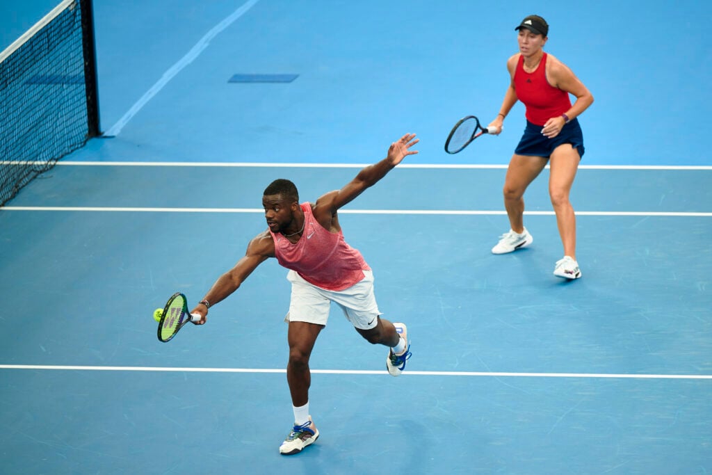 Frances Tiafoe hits a backhand in a doubles match alongside Jessica Pegula at the 2023 United Cup - Sydney: Day 6